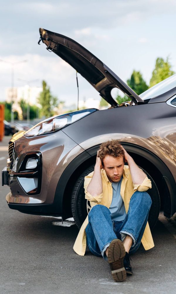 young-guy-near-the-car-with-an-open-hood-1-1.jpg